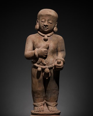 Lot 298 - A MAJAPAHIT TERRACOTTA FIGURE OF A BOY HOLDING A FISH