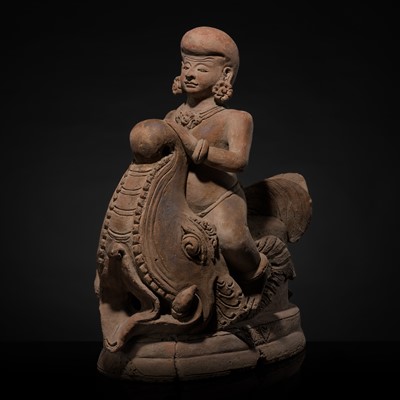 Lot 203 - A MAJAPAHIT TERRACOTTA JALADVARA OF A BOY RIDING A MAKARA