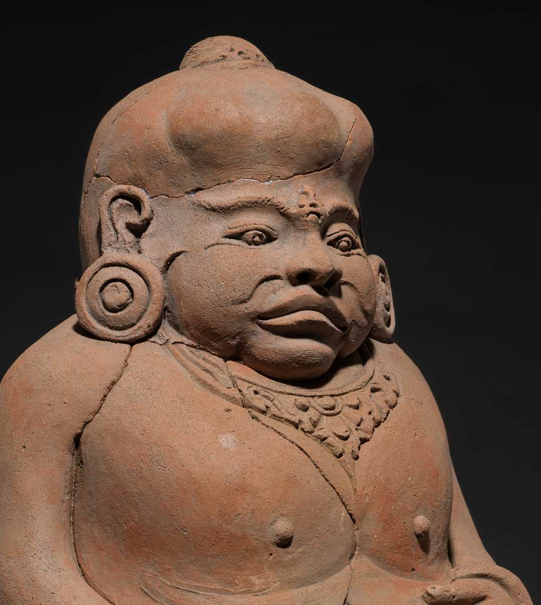 Lot 479 - A MAJAPAHIT TERRACOTTA FIGURE OF A PUNAKAWAN, ROYAL SERVANT