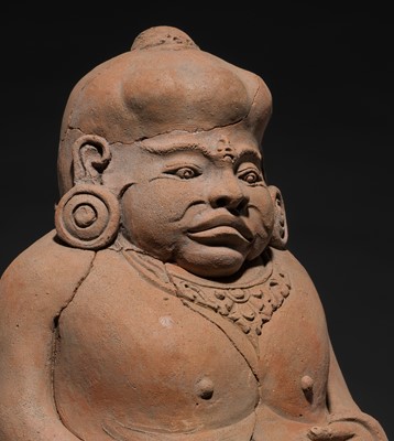 Lot 204 - A MAJAPAHIT TERRACOTTA FIGURE OF A PUNAKAWAN, ROYAL SERVANT