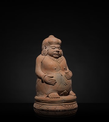 Lot 479 - A MAJAPAHIT TERRACOTTA FIGURE OF A PUNAKAWAN, ROYAL SERVANT