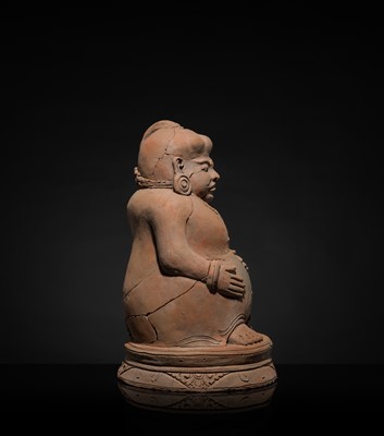 Lot 479 - A MAJAPAHIT TERRACOTTA FIGURE OF A PUNAKAWAN, ROYAL SERVANT