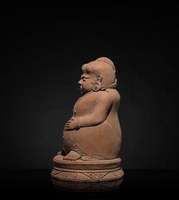 Lot 479 - A MAJAPAHIT TERRACOTTA FIGURE OF A PUNAKAWAN, ROYAL SERVANT
