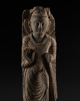 Lot 572 - A GRAY SCHIST FIGURE OF BUDDHA SHAKYAMUNI, SIKRI, ANCIENT REGION OF GANDHARA, CIRCA 3RD CENTURY