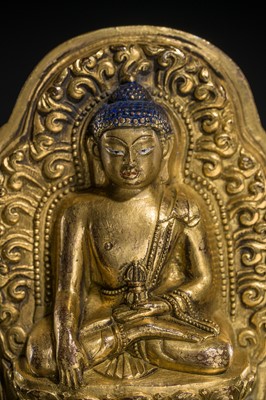 Lot 275 - A GILT-BRONZE VOTIVE PLAQUE OF BUDDHA AKSHOBHYA, TIBET, 18TH CENTURY