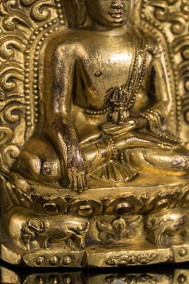 Lot 275 - A GILT-BRONZE VOTIVE PLAQUE OF BUDDHA AKSHOBHYA, TIBET, 18TH CENTURY