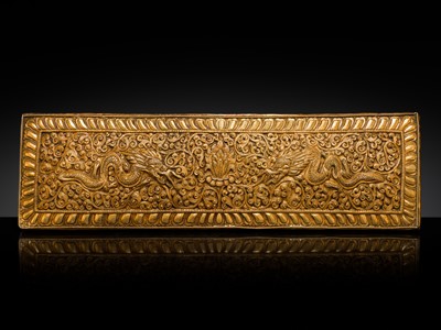 Lot 282 - A GILT COPPER REPOUSSÉ SUTRA COVER, TIBET, 18TH-19TH CENTURY