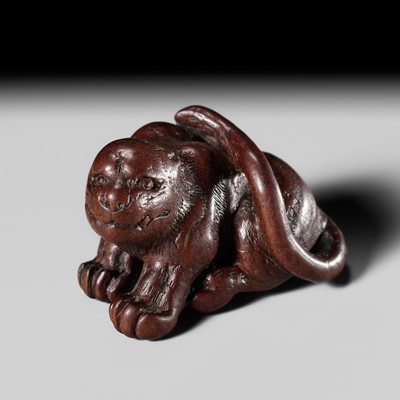 Lot 201 - KOKEI: A WOOD NETSUKE OF A TIGER