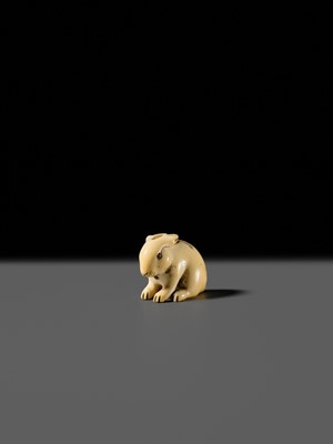 Lot 120 - RANICHI: A FINE IVORY NETSUKE OF A PIEBALD HARE WITH AMBER EYES