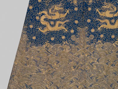 Lot 104 - AN IMPERIAL GOLD- AND SILVER-EMBROIDERED ‘NINE DRAGON’ ROBE, JIFU, QIANLONG
