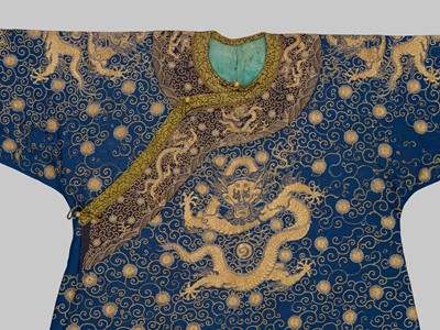 Lot 104 - AN IMPERIAL GOLD- AND SILVER-EMBROIDERED ‘NINE DRAGON’ ROBE, JIFU, QIANLONG