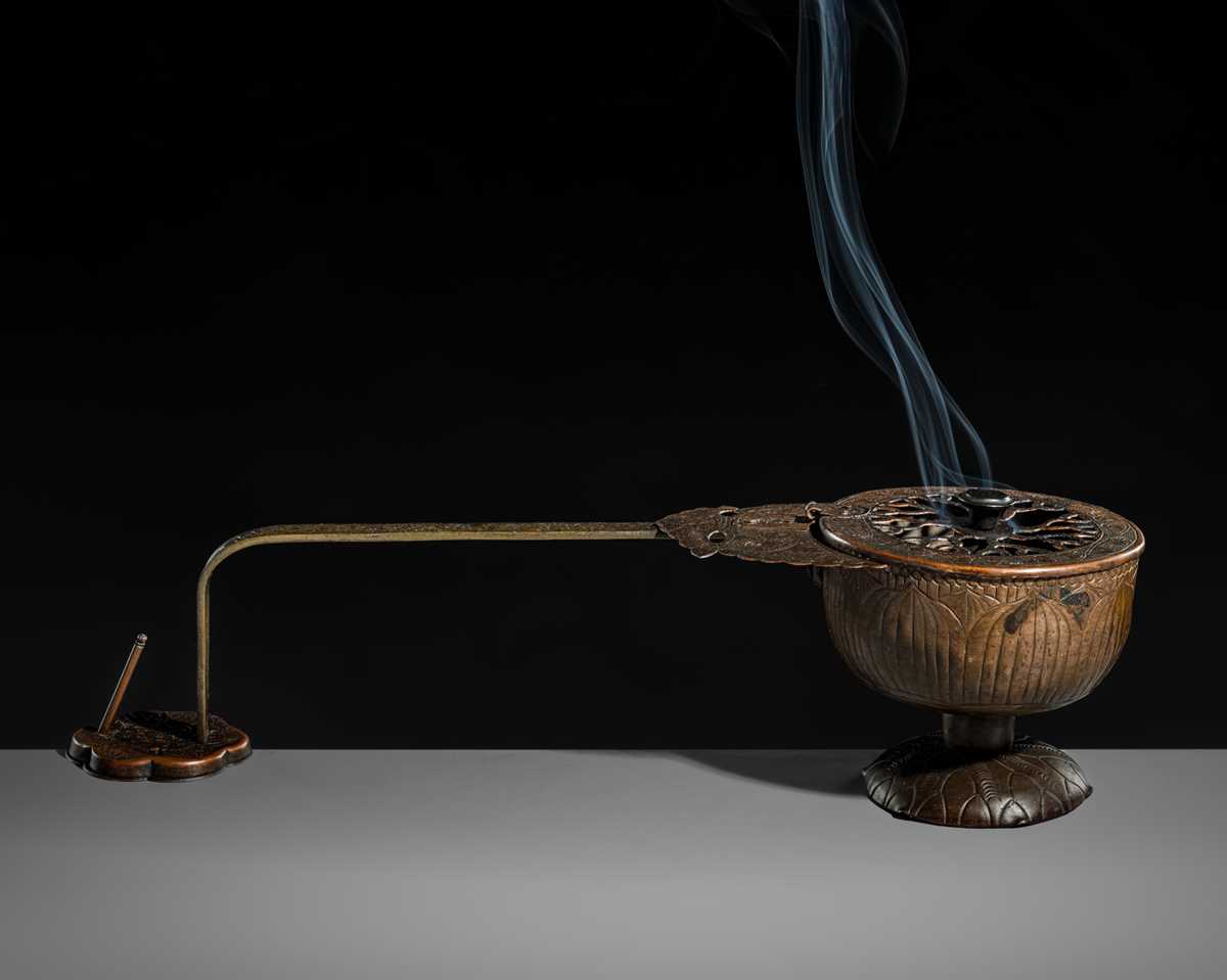 A BRONZE AND COPPER ‘LOTUS’ EKORO (LONG-HANDLED CENSER), NANBOKUCHO PERIOD