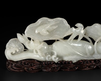 Lot 139 - A WHITE JADE ‘LOTUS ROOT AND BIRDS’ BRUSH REST, QIANLONG PERIOD