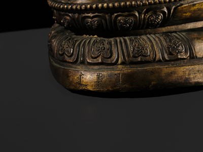 Lot 85 - A GILT-BRONZE REPOUSSÉ FIGURE OF THE CONTEMPLATING WISDOM BUDDHA, GUAN CHA HUI FO, QIANLONG INCISED SEVEN-CHARACTER MARK AND PERIOD