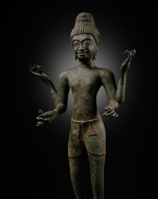 Lot 249 - A RARE AND LARGE BRONZE FIGURE OF AVALOKITESHVARA, PROBABLY FROM THE “PRAKHON CHAI HOARD”, PRE-ANGKOR, EARLY 8TH CENTURY