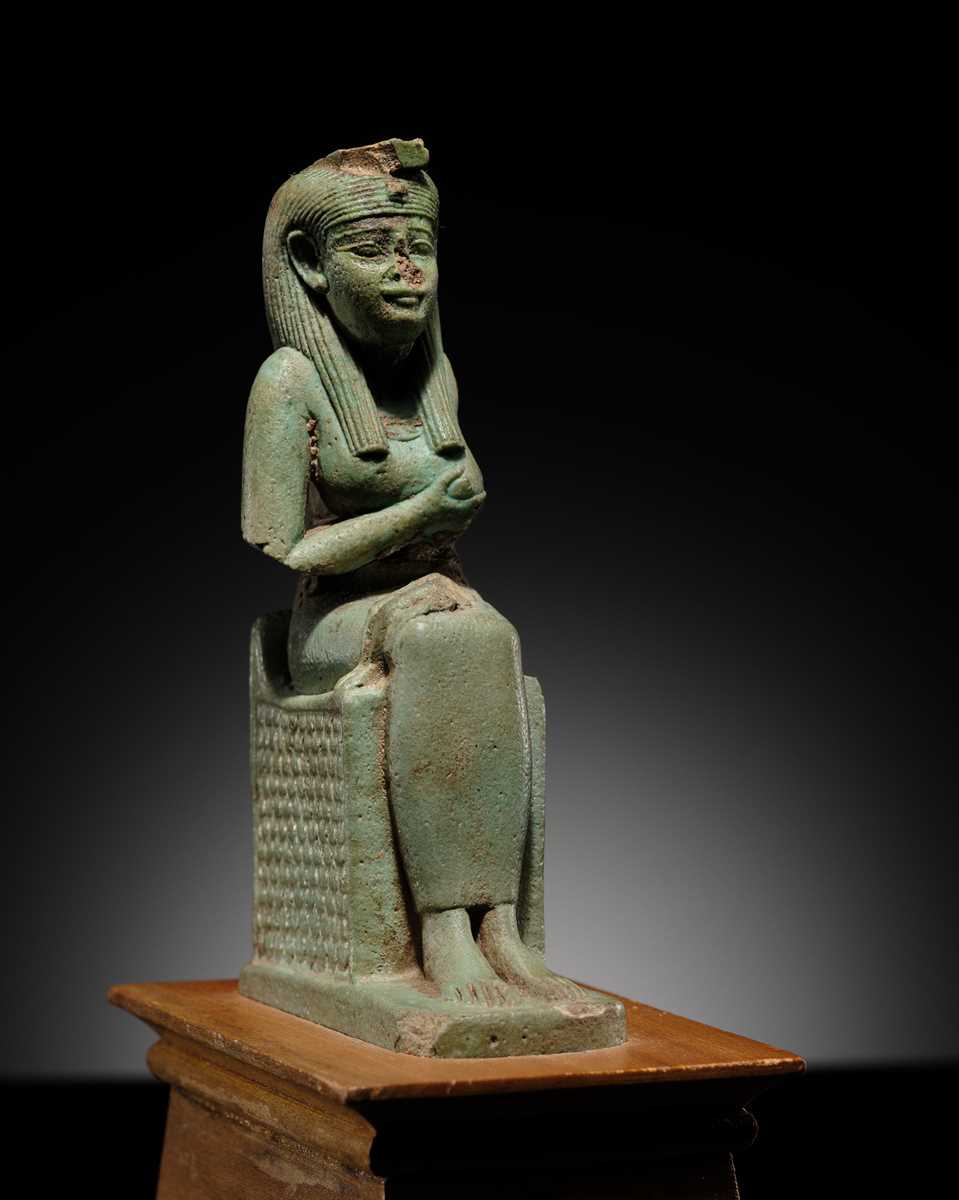 Lot 57 - A PALE TURQUOISE FAIENCE FIGURE OF ISIS AND HORUS, LATE PERIOD TO PTOLEMAIC ERA