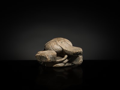 Lot 32 - AN INDURATED LIMESTONE FIGURE OF A WINGED SCARAB, KHEPRI, MIDDLE KINGDOM TO LATE PERIOD