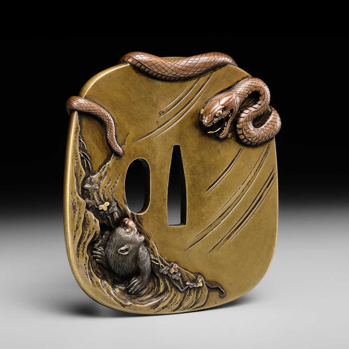 Lot 53 - ICHIRYU TOMOTOSHI: A SUPERB AND LARGE MITO SCHOOL SENTOKU TSUBA WITH SNAKE AND MONKEY