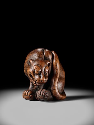 Lot 107 - A LARGE AND IMPRESSIVE WOOD NETSUKE OF A TIGER