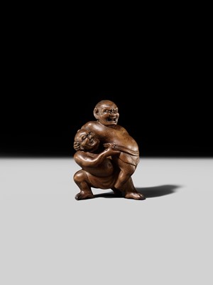 Lot 129 - MASAKAZU: A WOOD NETSUKE OF TWO SUMO WRESTLERS