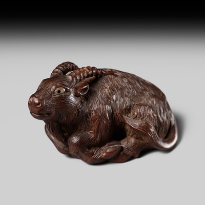 Lot 202 - KOKEI: A FINE WOOD NETSUKE OF A RECUMBENT GOAT
