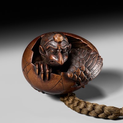 Lot 260 - HARA SHUMIN: A FINE WOOD NETSUKE OF A HATCHING TENGU (TENGU NO TOMAGO)