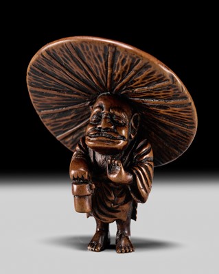 Lot 251 - AN UNUSUAL WOOD NETSUKE OF AN ONI AS A SAKE PEDDLER