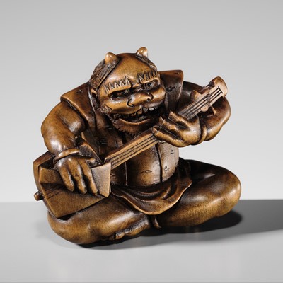 MASATAMI: A LARGE WOOD NETSUKE OF AN ONI PLAYING A LUTE (SAMISEN)