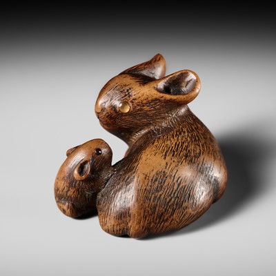 Lot 186 - A RARE WOOD NETSUKE OF A PICA AND YOUNG