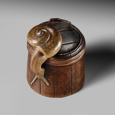 Lot 220 - SHIGEMASA: A SUPERB WOOD NETSUKE OF A SNAIL ON A BUCKET