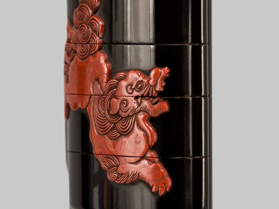 Lot 7 - YOZEI: A FOUR-CASE TSUISHU-INLAID LACQUER INRO DEPICTING SHISHI AND PEONY