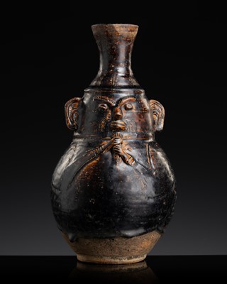 Lot 135 - A LARGE DARK BROWN GLAZED ANTHROPOMORPHIC STONEWARE JAR IN THE FORM OF A SAGE, ANGKOR PERIOD