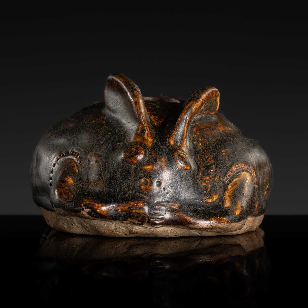 A RARE DARK BROWN GLAZED STONEWARE ‘HARE’ LIME POT, ANGKOR PERIOD