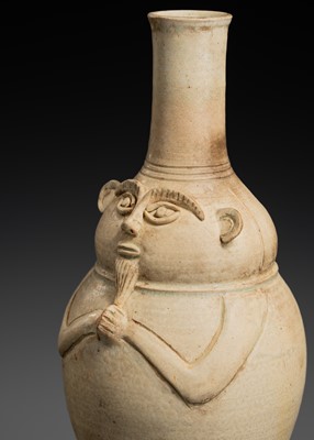 Lot 136 - A CELADON GLAZED ANTHROPOMORPHIC STONEWARE JAR, ANGKOR PERIOD