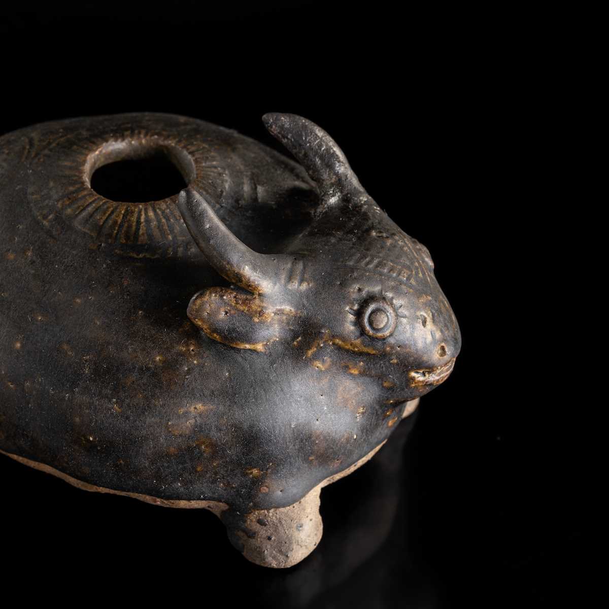 A RARE DARK-BROWN GLAZED STONEWARE ‘OX’ LIME POT, ANGKOR PERIOD