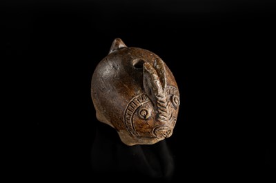 Lot 127 - A SMALL BROWN GLAZED STONEWARE ‘HARE’ LIME POT, ANGKOR PERIOD