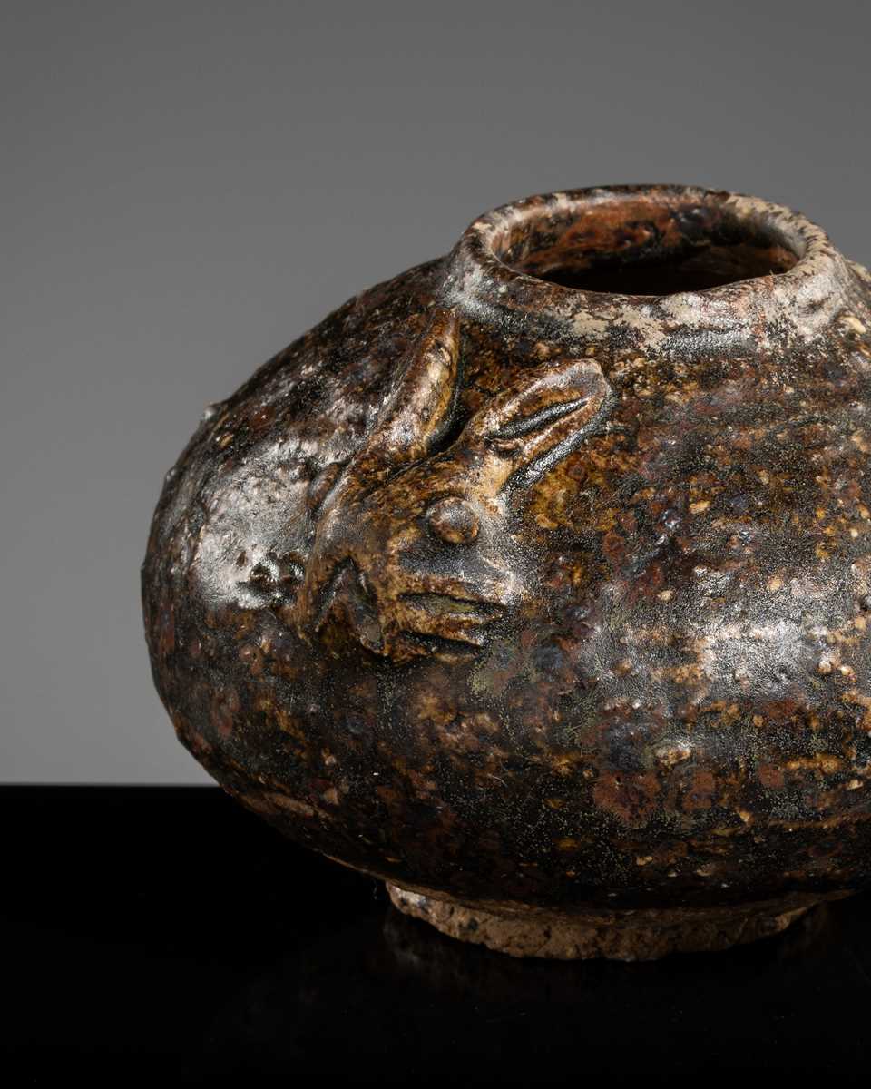 A DARK BROWN GLAZED STONEWARE ‘RABBIT’ LIME POT, ANGKOR PERIOD