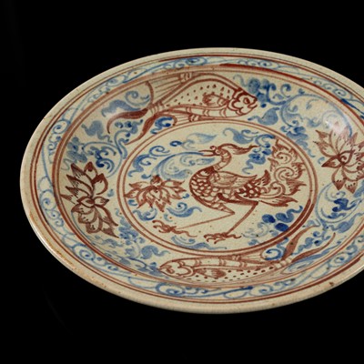 A THAI UNDERGLAZE BLUE AND IRON RED DECORATED STONEWARE DISH