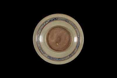 A THAI UNDERGLAZE BLUE AND IRON RED DECORATED STONEWARE DISH