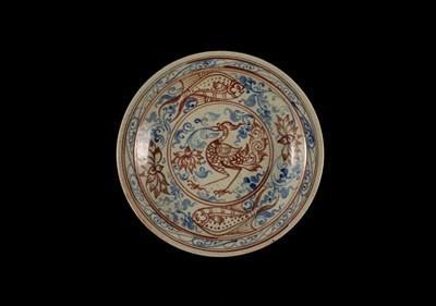 A THAI UNDERGLAZE BLUE AND IRON RED DECORATED STONEWARE DISH