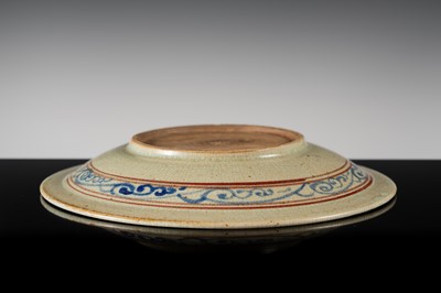 A THAI UNDERGLAZE BLUE AND IRON RED DECORATED STONEWARE DISH