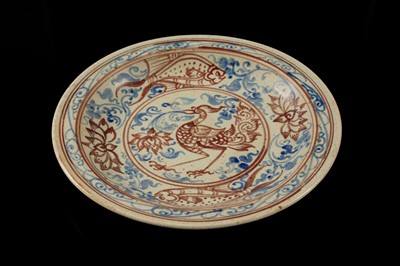 A THAI UNDERGLAZE BLUE AND IRON RED DECORATED STONEWARE DISH