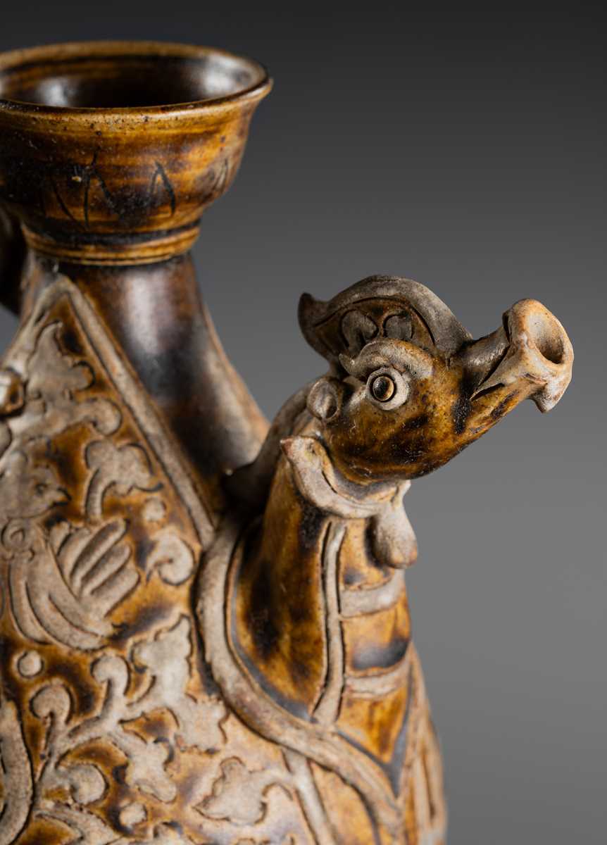 A SAWANKHALOK BROWN-GLAZED STONEWARE DRAGON EWER, 17TH–18TH CENTURY