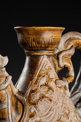 A SAWANKHALOK BROWN-GLAZED STONEWARE DRAGON EWER, 17TH–18TH CENTURY