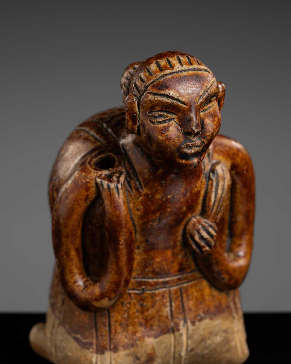 A SAWANKHALOK STONEWARE JOS STICK HOLDER IN SHAPE OF A MAN, 15TH–16TH CENTURY