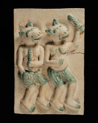 Lot 172 - A BURMESE GREEN AND WHITE-GLAZED TERRACOTTA WALL TILE WITH SOLDIERS OF THE ARMY OF MARA
