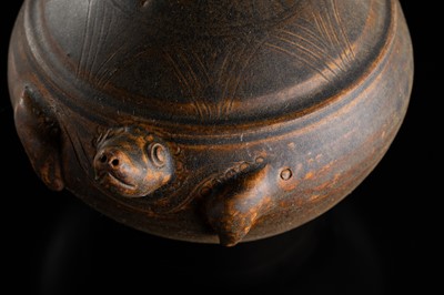 A KHMER STYLE DARK BROWN GLAZED STONEWARE JAR IN THE FORM OF A TORTOISE