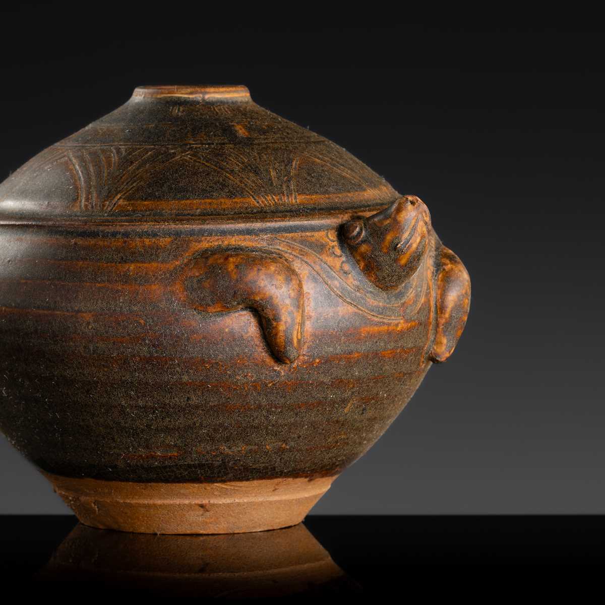 A KHMER STYLE DARK BROWN GLAZED STONEWARE JAR IN THE FORM OF A TORTOISE