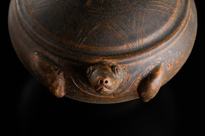 A KHMER STYLE DARK BROWN GLAZED STONEWARE JAR IN THE FORM OF A TORTOISE