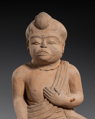 Lot 184 - A MAJAPAHIT TERRACOTTA FIGURE OF A SEATED MONK